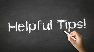 A person drawing and pointing at a "Helpful Tips" Chalk Illustration