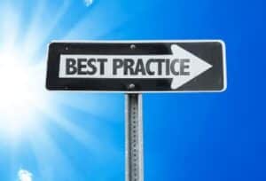 A one-way directional sign displays the words Best Practice