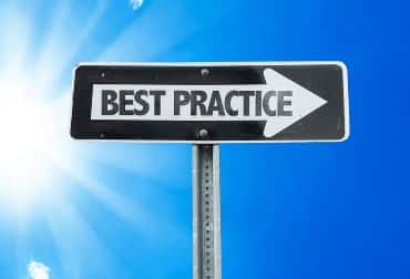 A one-way directional sign displays the words Best Practice